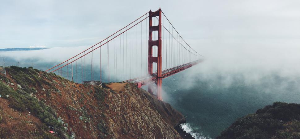 Free Image of Golden Gate Bridge shrouded in misty coastal fog. 