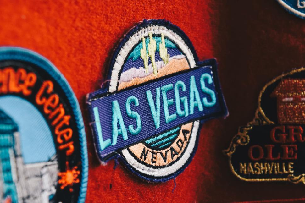 Free Image of Las Vegas patch with Nevada text on red background. 