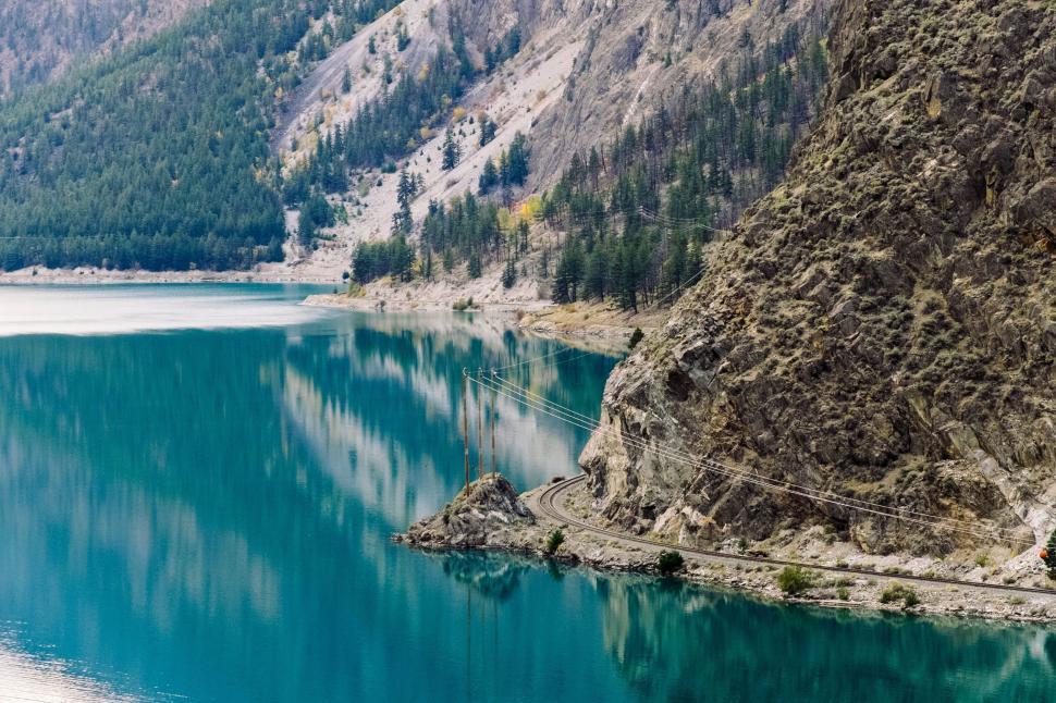 Free Image of Mountainous Landscape with Calm Blue Lake Reflections 