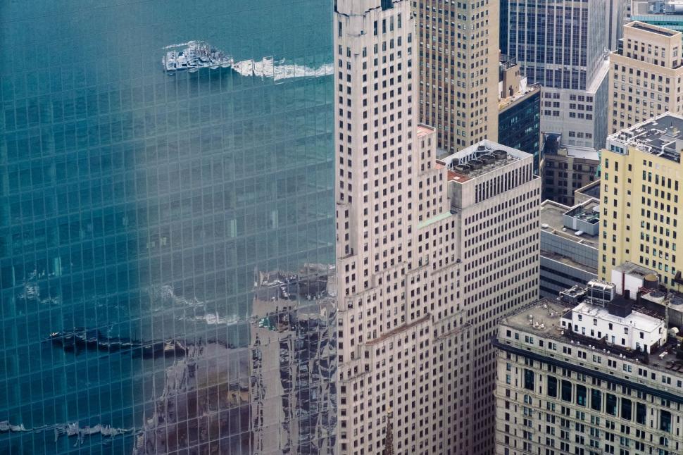 Free Image of Urban cityscape with high-rise buildings and reflections. 