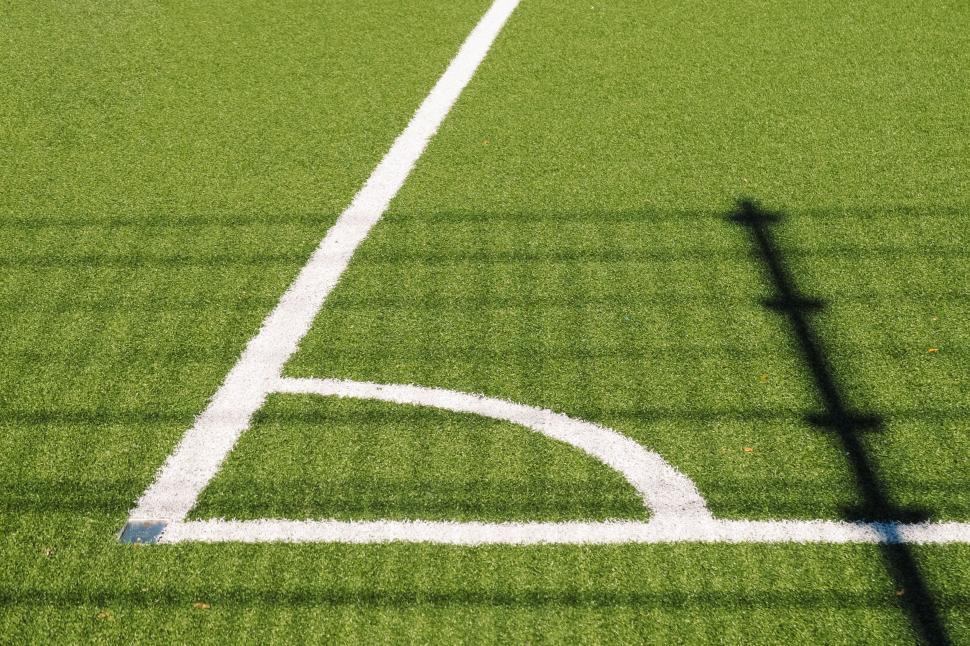 Free Image of Corner of a Soccer Field with Green Synthetic Turf Lines 