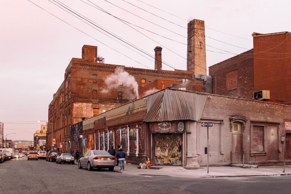 Free Image of Urban Street Scene with Brick Buildings at Sunset Time 