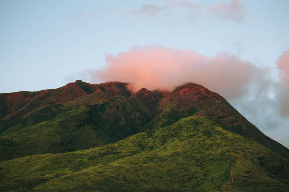 Free Image of Mountain landscape with lush greenery and cloud cover 