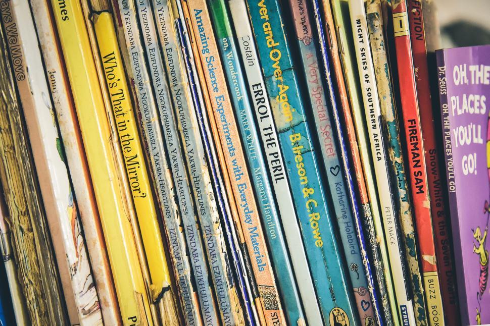 Free Image of Shelf of children s books with colorful spines visible. 