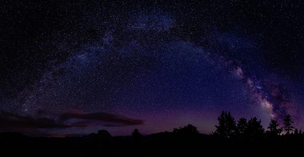 Free Image of Panoramic view of Milky Way and star-filled night sky. 