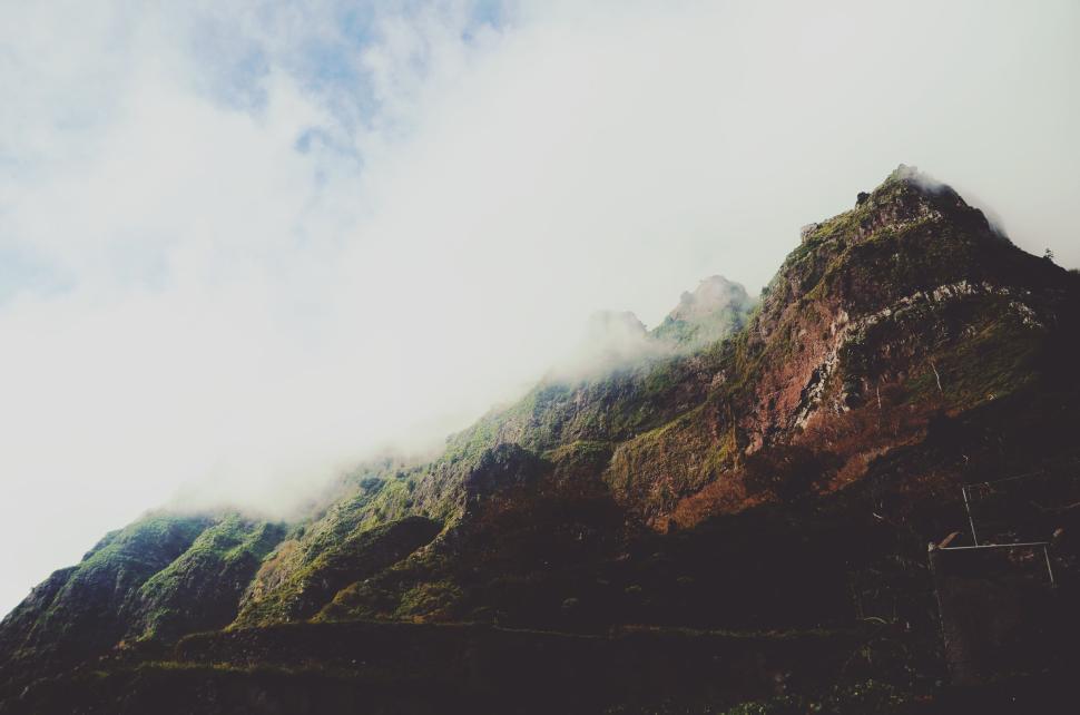Free Image of Foggy Mountain with Greenery and Rocky Terrain 