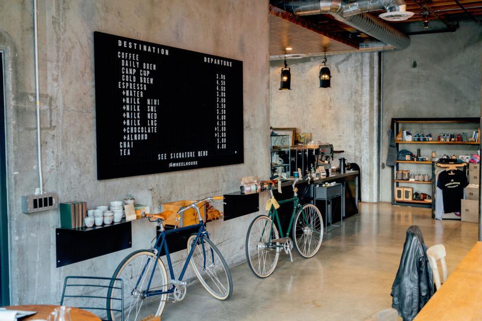 Free Image of Caf? interior with modern decor and bicycles on display 