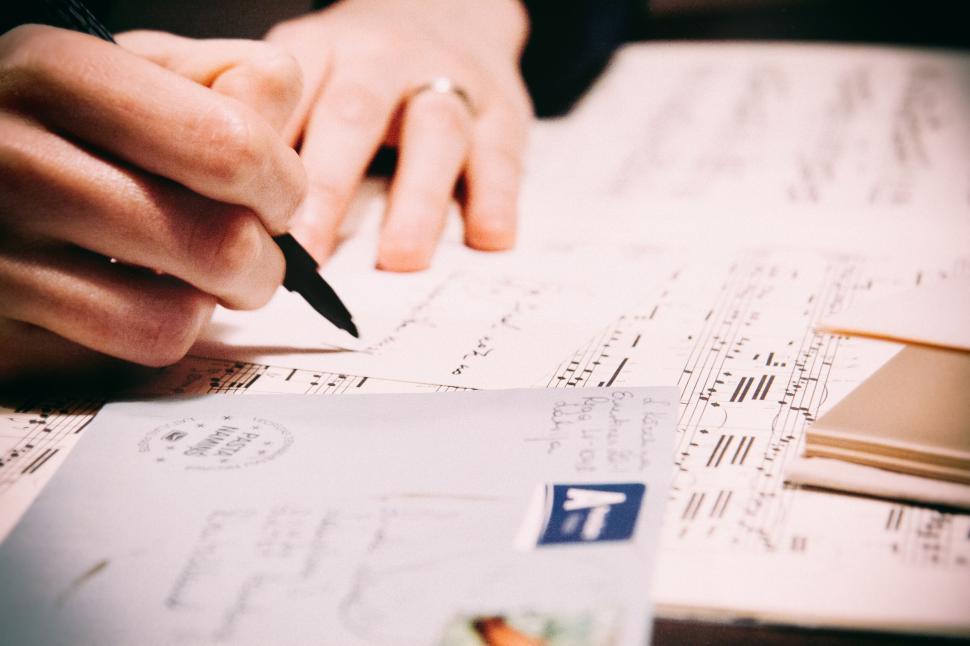 Free Image of Handwriting a letter on a vintage postcard 