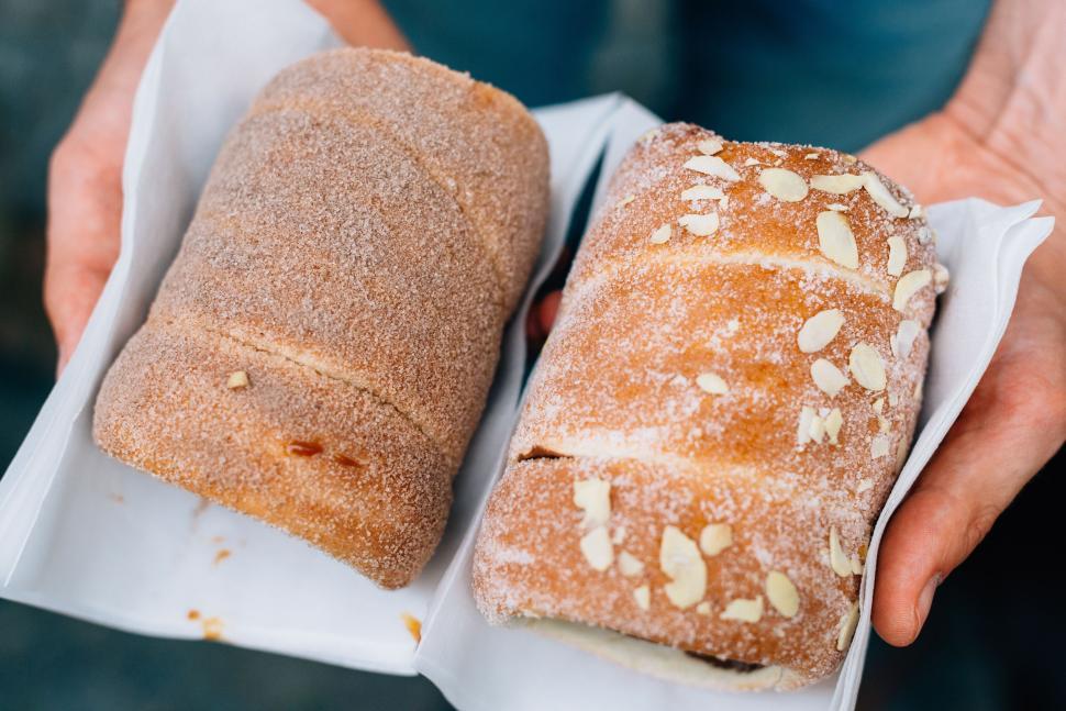 Free Image of Close-up of two types of delicious pastries in hand. 