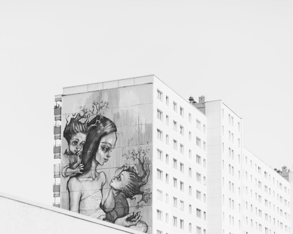 Free Image of Detailed mural on an urban building with artistic elements. 