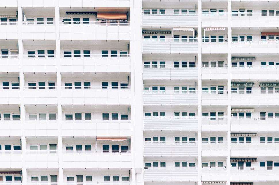 Free Image of Modern white apartment building with repetitive balconies. 