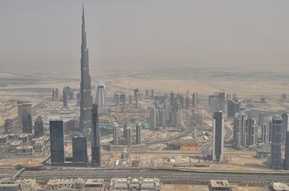 Free Image of Skyline of Dubai with Burj Khalifa standing prominently 
