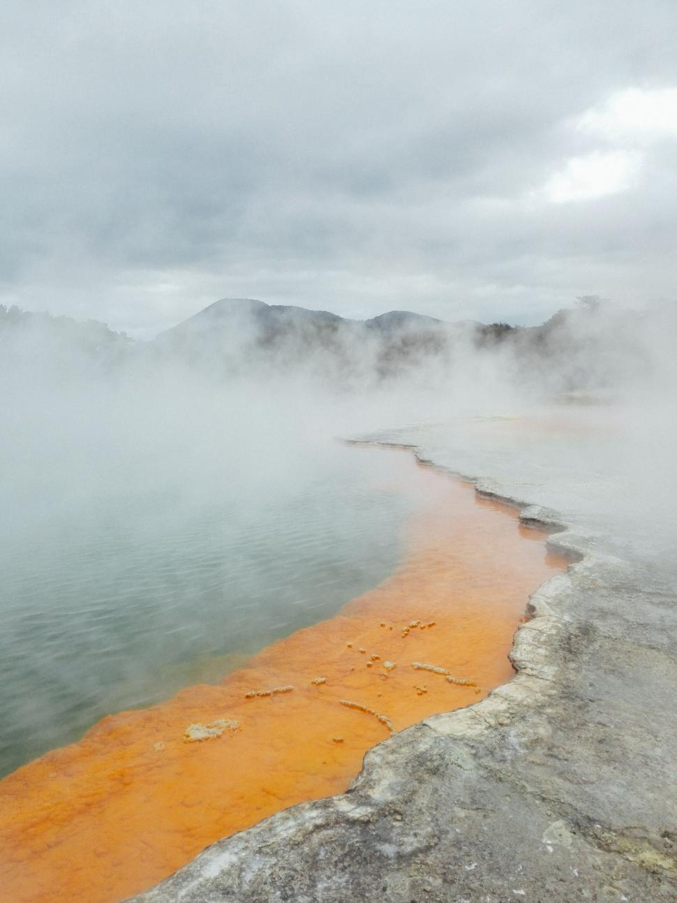 Free Image of Misty geothermal hot spring with colorful minerals 
