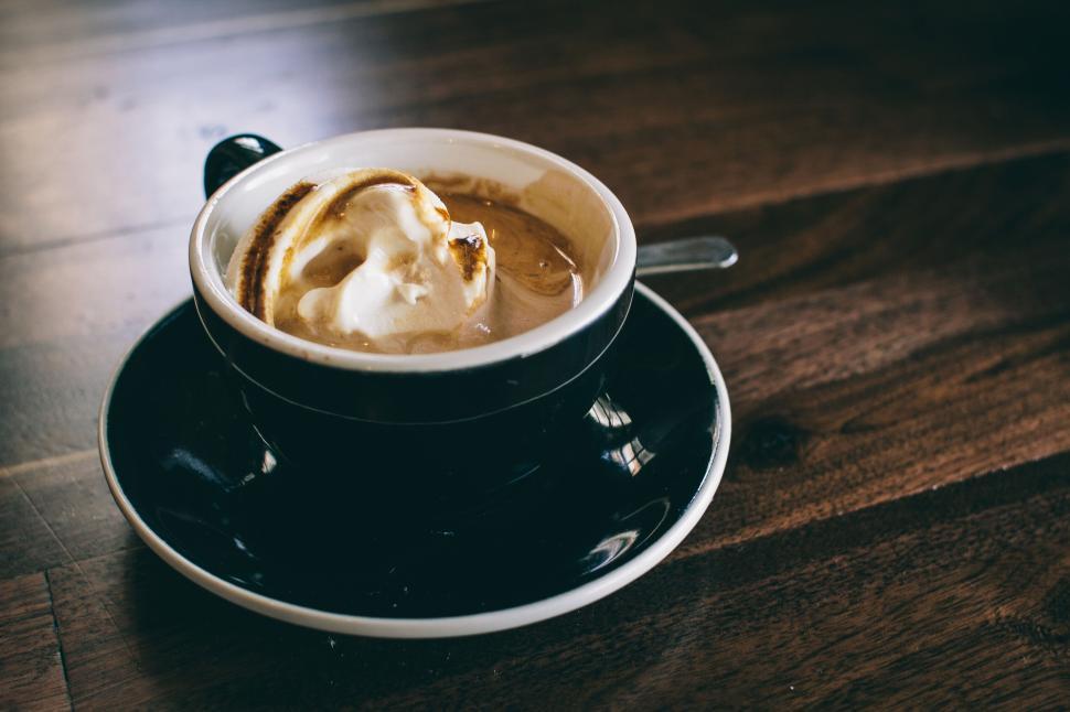 Free Image of Close-up of cup of coffee with whipped cream on top. 
