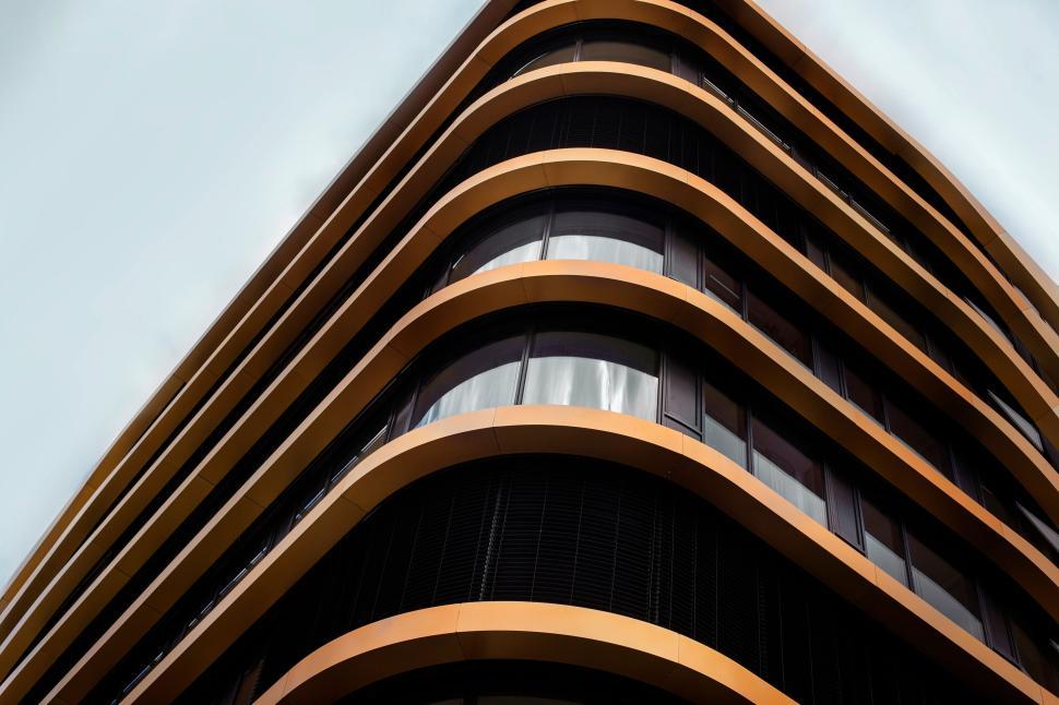 Free Image of Curved modern building with sleek glass windows. 