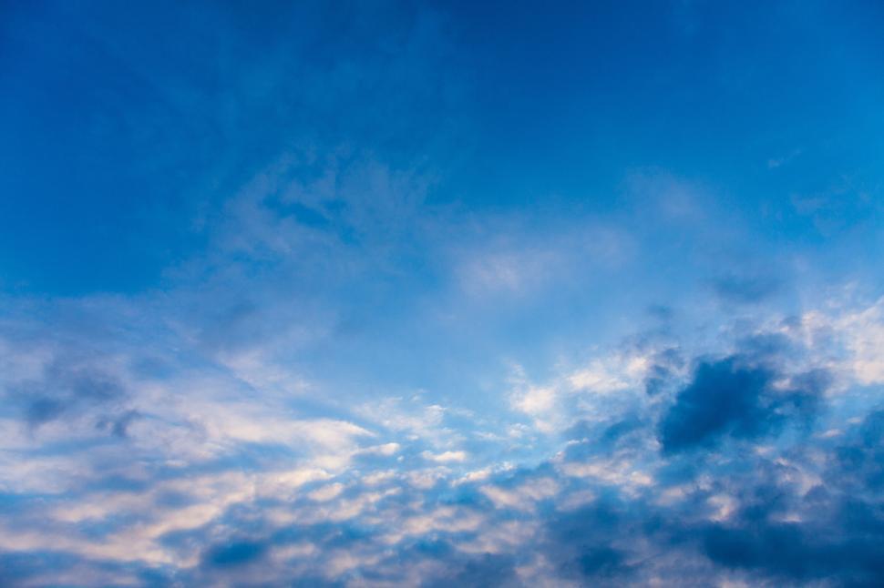 Free Image of Blue sky with soft white clouds, beautiful and serene. 