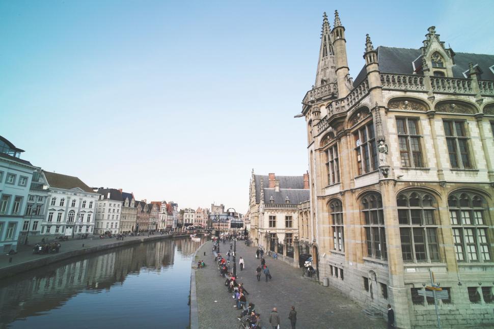 Free Image of Canal with historic buildings beside tranquil waterway 