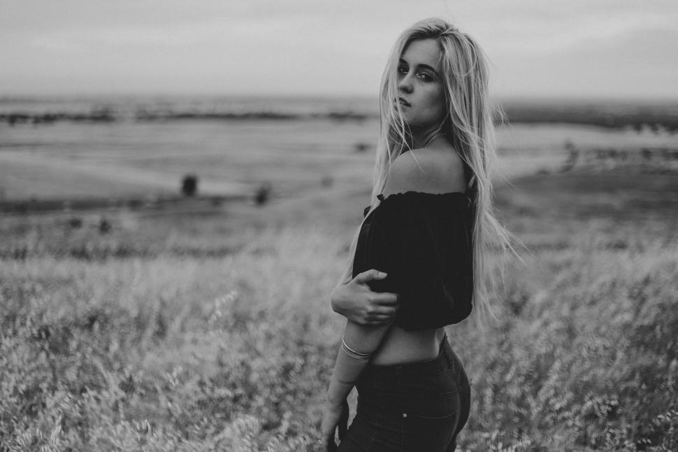 Free Image of Black and white photo of woman in off-shoulder top 