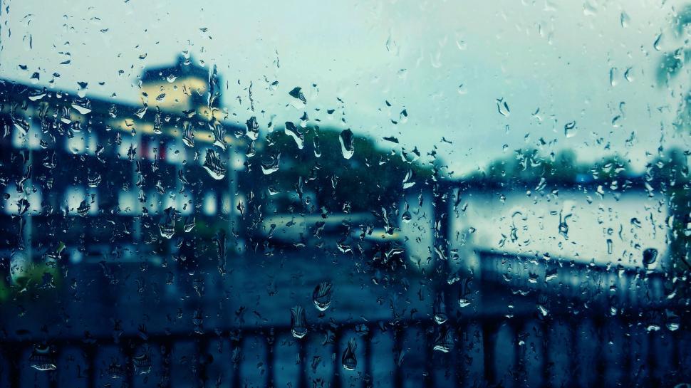 Free Image of View through a rainy window with drops on glass pane 