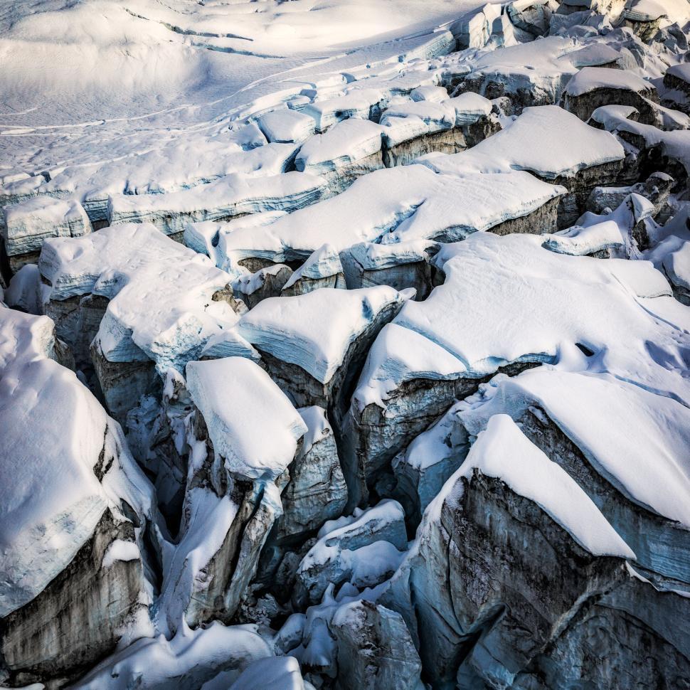 Free Image of Frozen ice crevasses forming intricate glacial patterns 