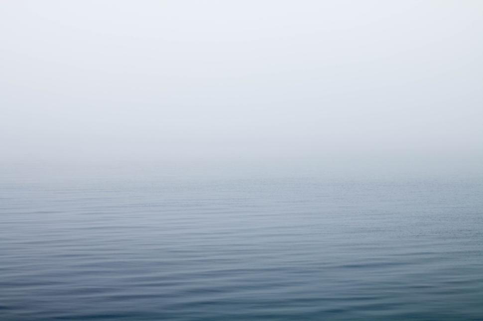 Free Image of Calm and serene view of an endless misty ocean 