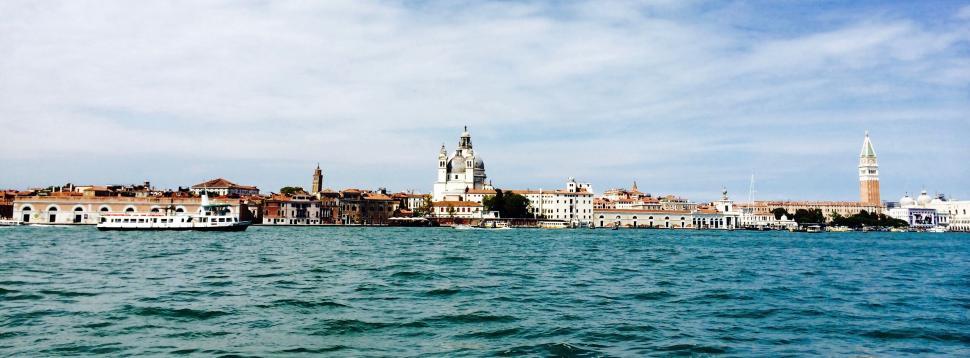 Free Image of Venice skyline with a boat on the open water. 