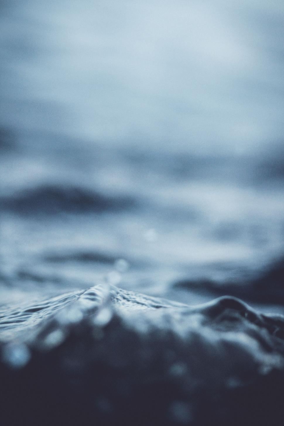 Free Image of Close-up of dark ocean waves with deep blue hues 