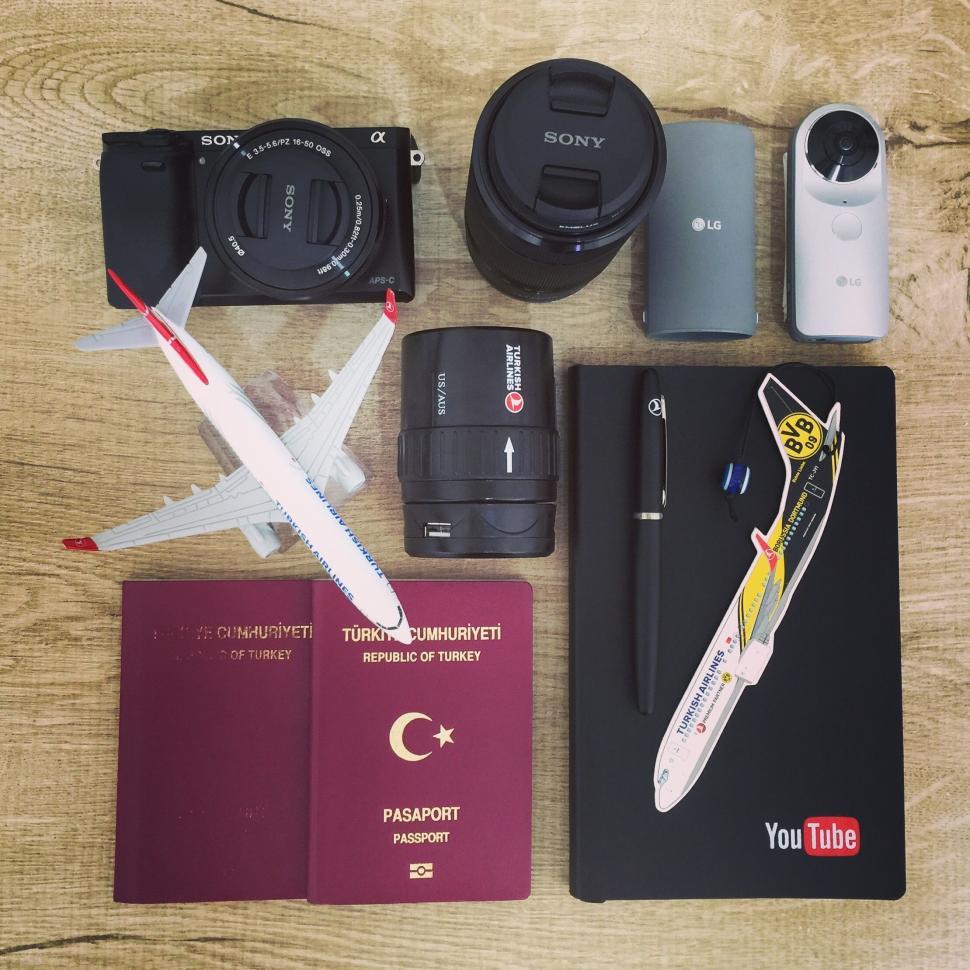 Free Image of Travel essentials including camera and passport 