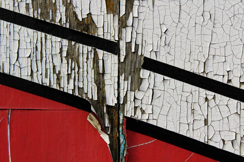 Free Image of Close-up of peeling paint on a weathered wooden surface 