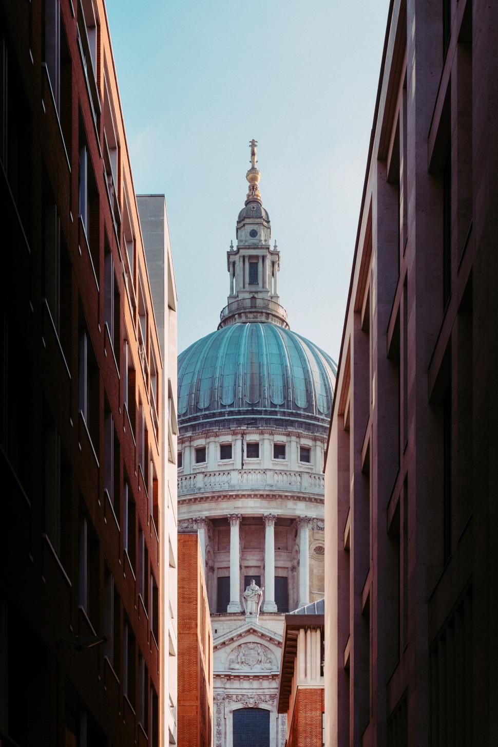 Free Image of St. Paul s Cathedral dome between urban buildings 