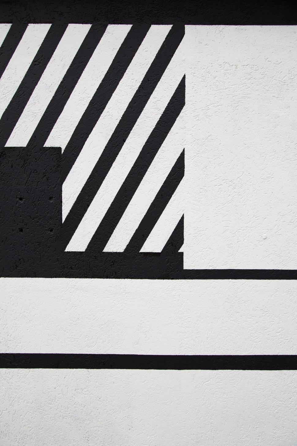 Free Image of Abstract black and white striped pattern on a wall 