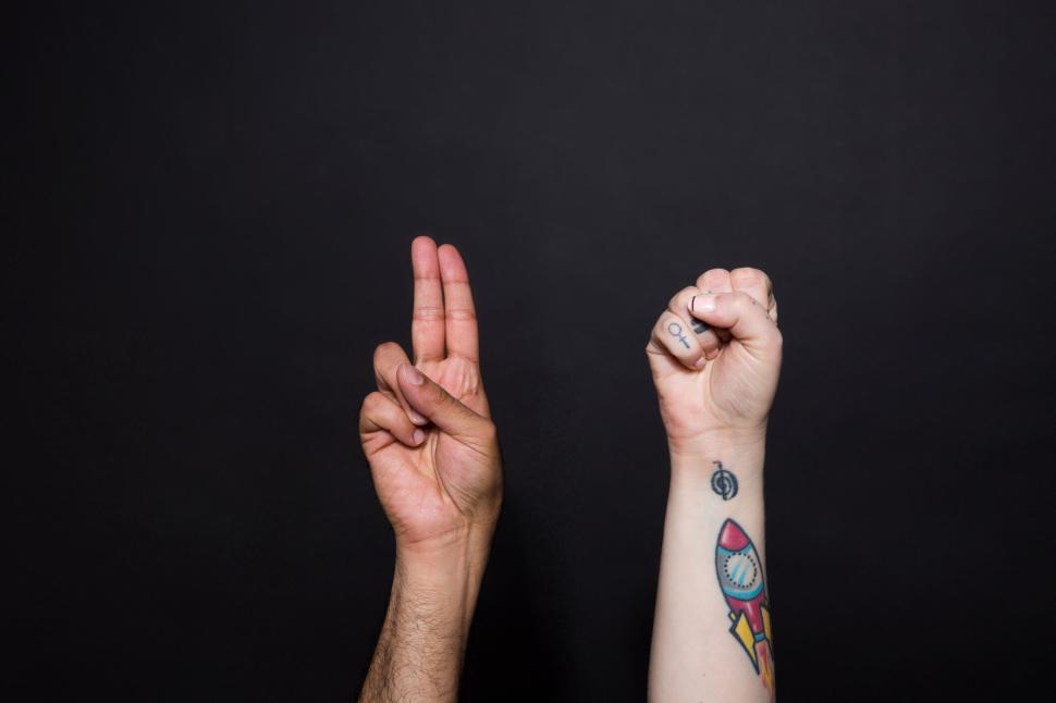 Free Image of Different hand symbols displayed on a plain black background. 