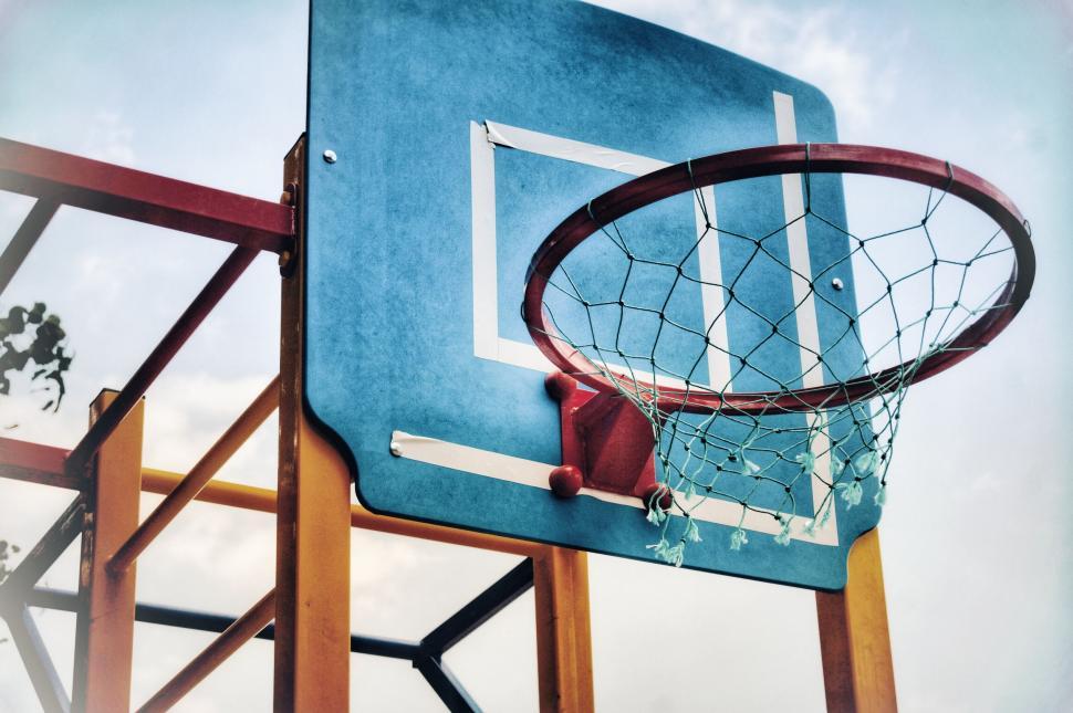 Free Image of Colorful playground basketball hoop with morning sunlight 
