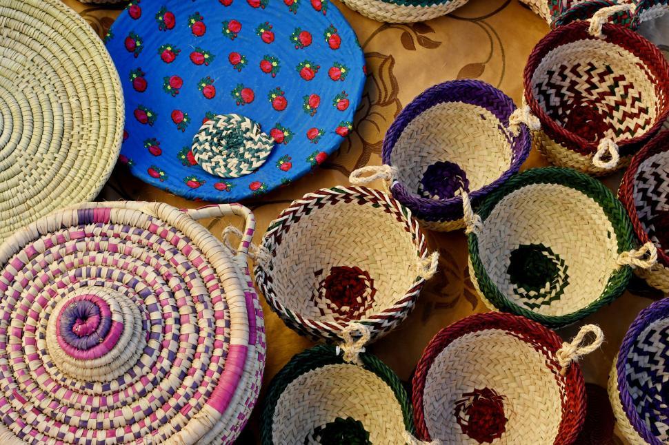 Free Image of Colorful woven baskets including circular and oval shapes 