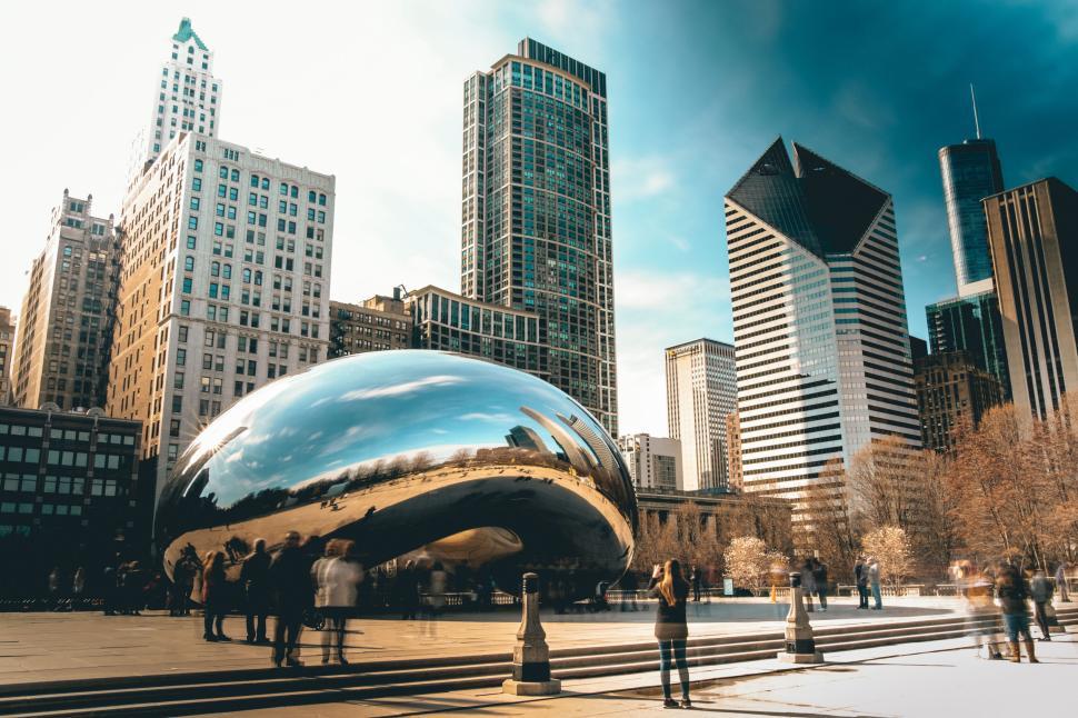 Free Image of Cloud Gate and Chicago skyline in the background. 