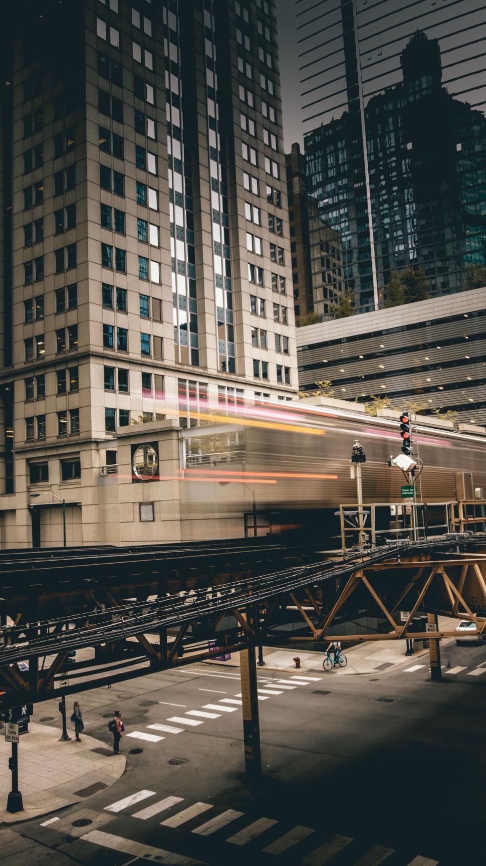 Free Image of Moving train on Chicago s elevated tracks with city view. 