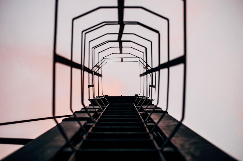 Free Image of Ladder perspective from below towards open sky above 