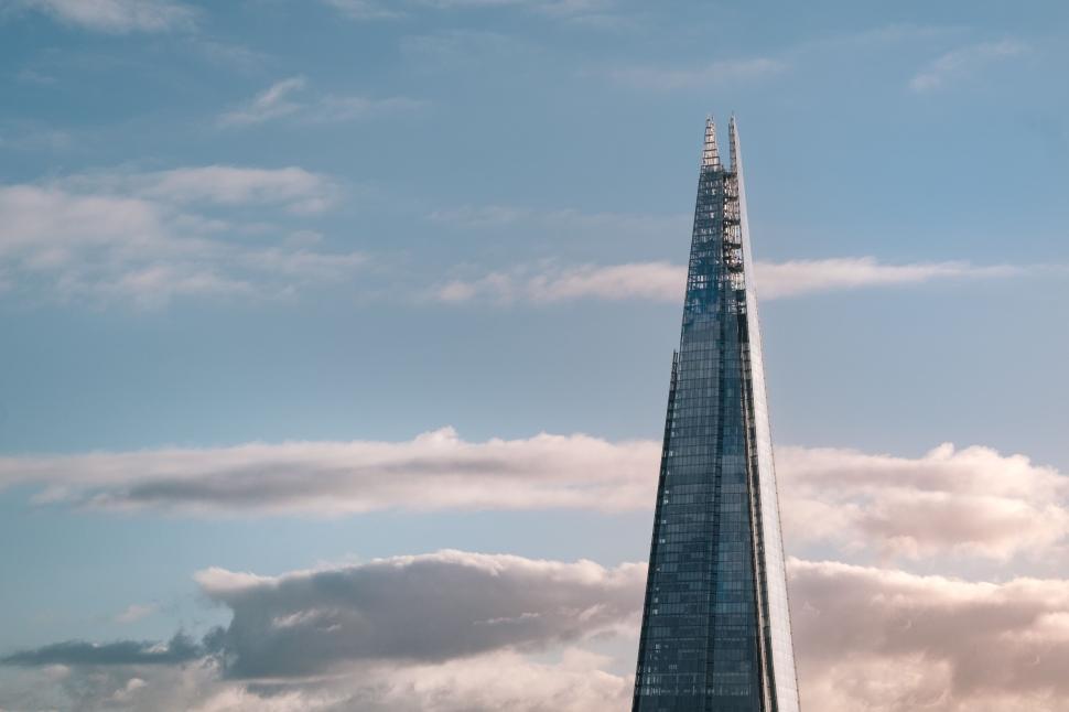 Free Image of Modern skyscraper with reflective glass facade at dusk 