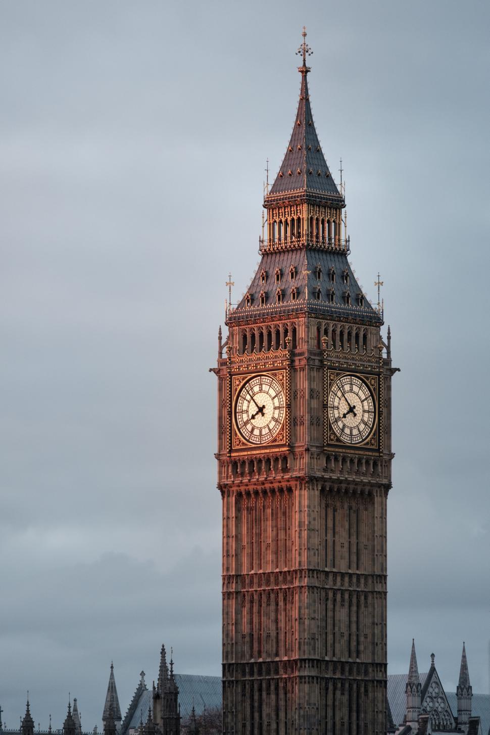 Free Image of Big Ben Clock Tower at sunset with a cloudy sky 
