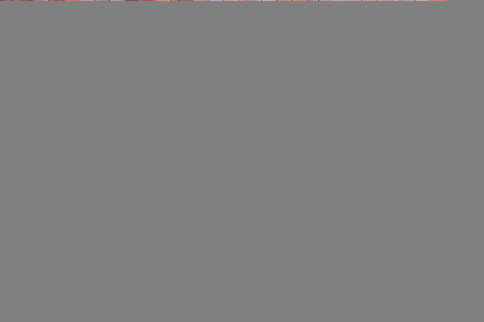 Free Image of Three round windows on patterned red brick facade wall 