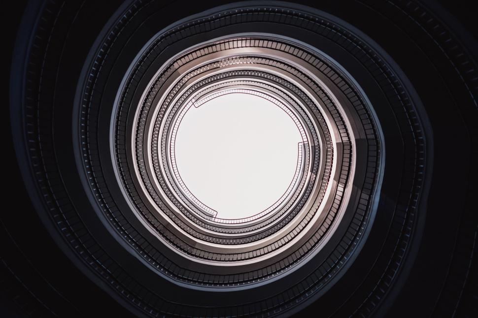 Free Image of Spiral staircase looking upwards with concentric circles 