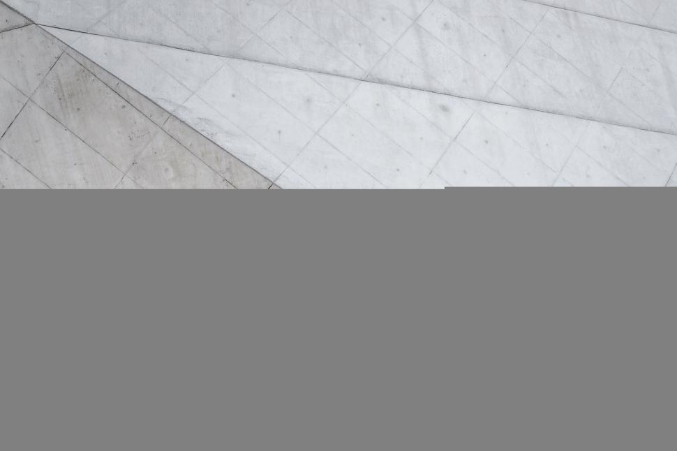 Free Image of Geometric abstract pattern on a gray textured surface. 