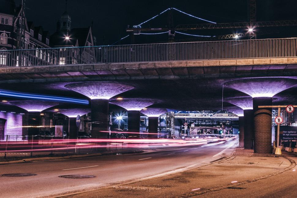 Free Image of Night urban scene with vibrant lights under a bridge 