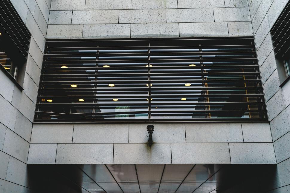 Free Image of Modern building exterior with a security camera outside. 