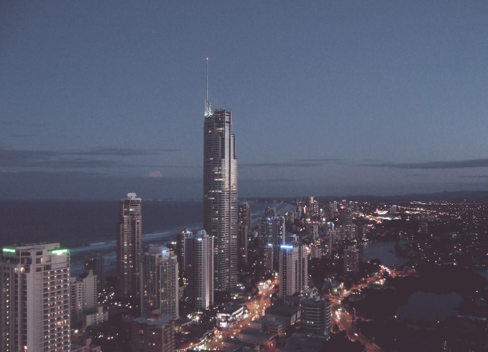 Free Image of City skyline at dusk with illuminated high-rise buildings 