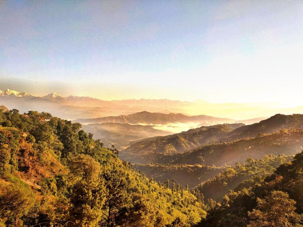 Free Image of Panoramic view of lush green hills and mountains 