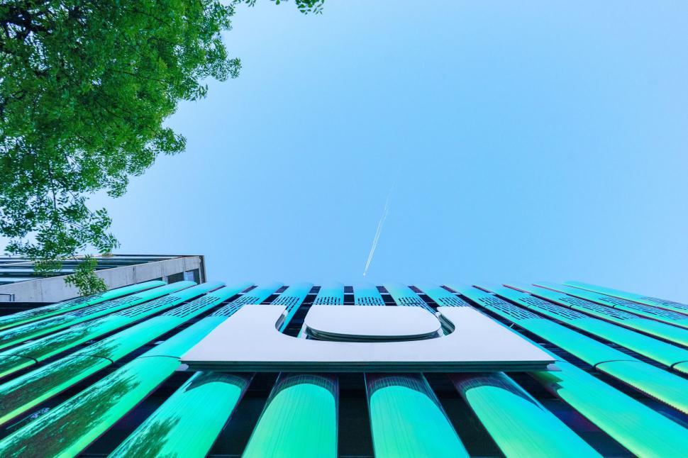 Free Image of Modern building with sky and tree in the background. 