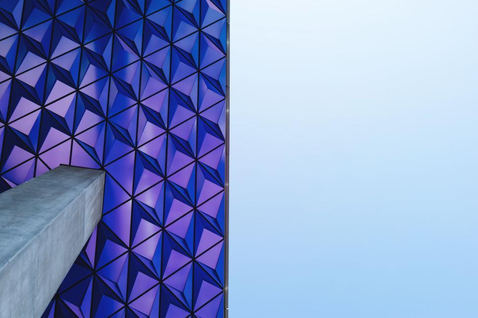 Free Image of Geometric purple patterned wall with concrete corner. 