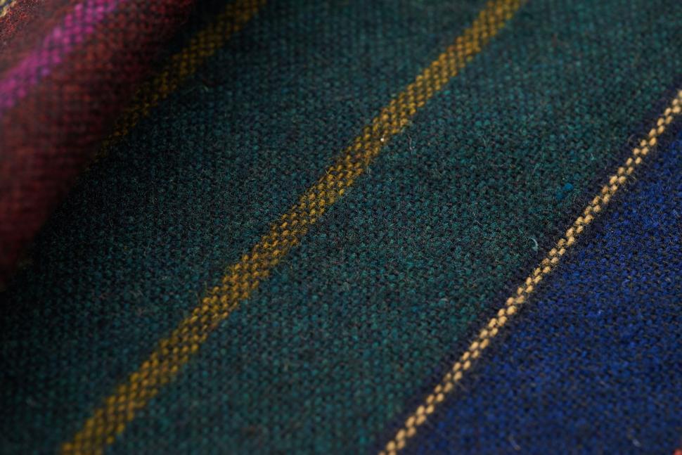 Free Image of Close-up of fabric with green and yellow striped pattern. 