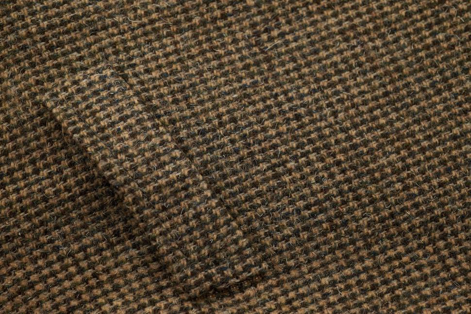 Free Image of Close-up of brown checkered fabric with pocket 